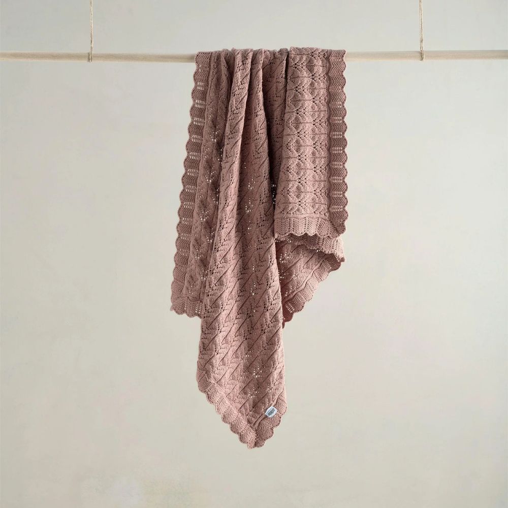 soft knitted blanket in dusty pink for your baby